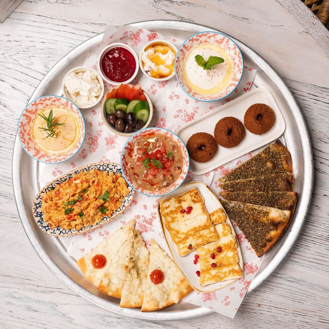 A large platter of mezze with many small dishes